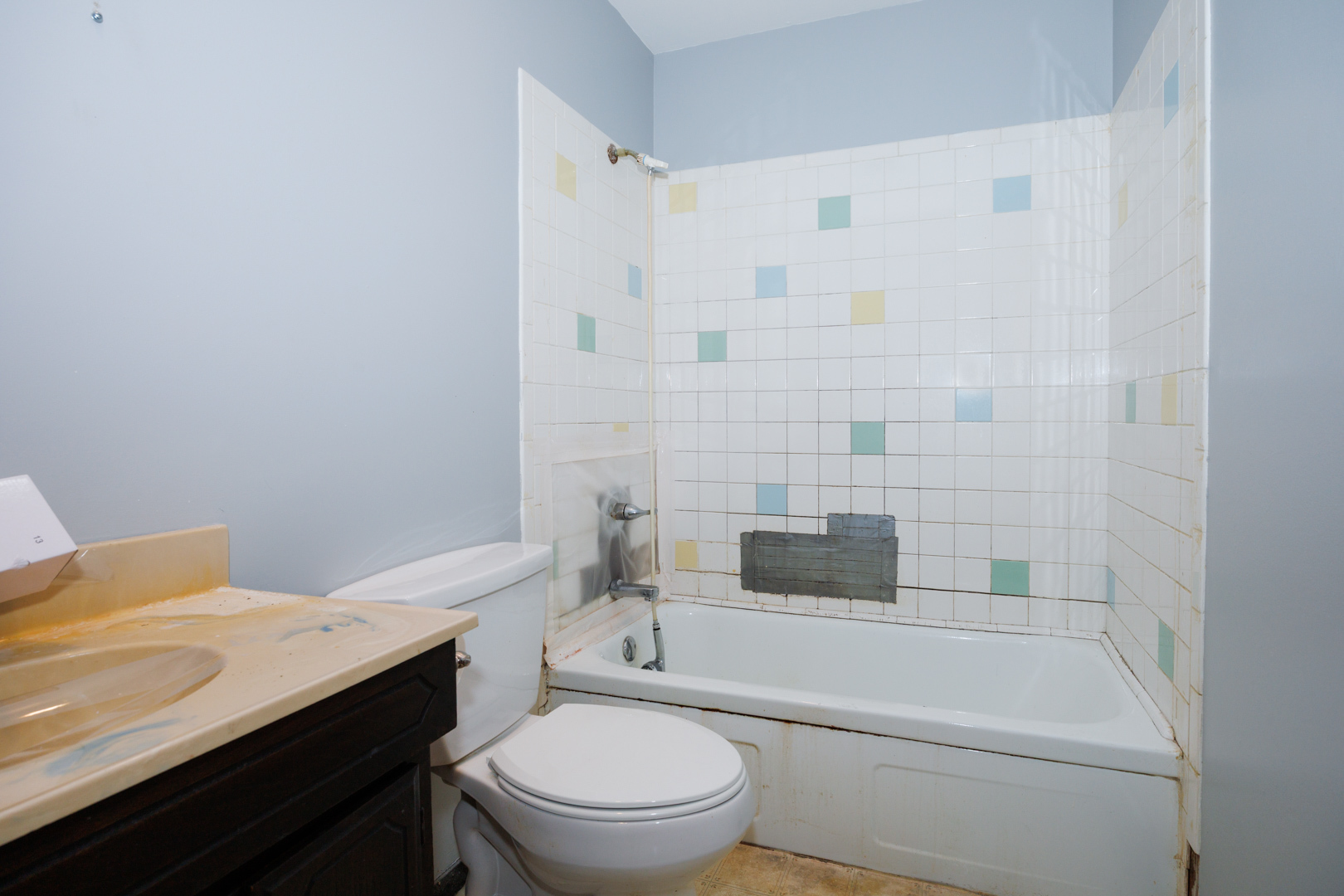 1307 Glenwood Road Bloomington, IL 61704 - Photo 12 of 21 a bathroom with a sink toilet vanity and shower