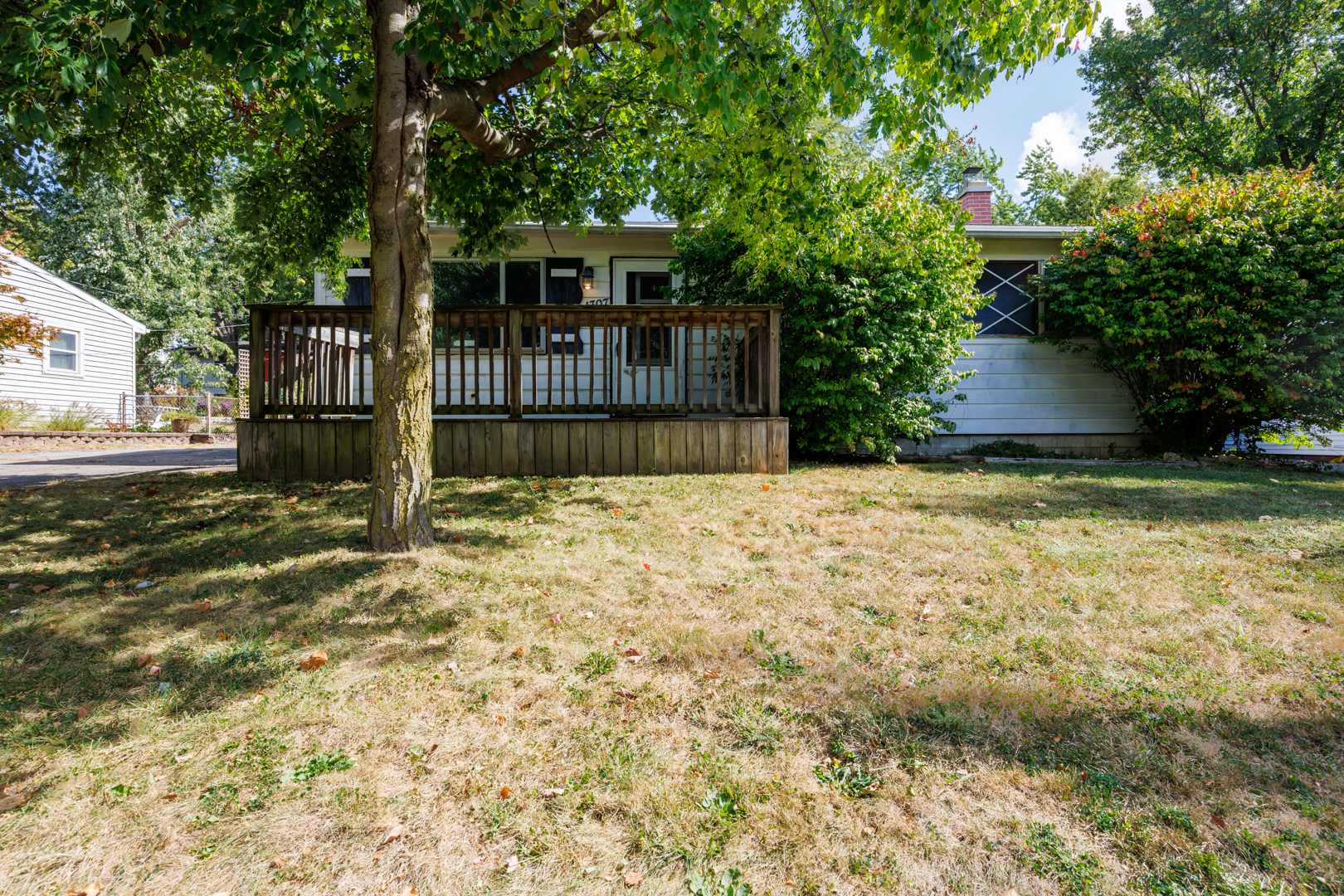 1307 Glenwood Road Bloomington, IL 61704 - Photo 18 of 21 a view of a house with a wooden fence