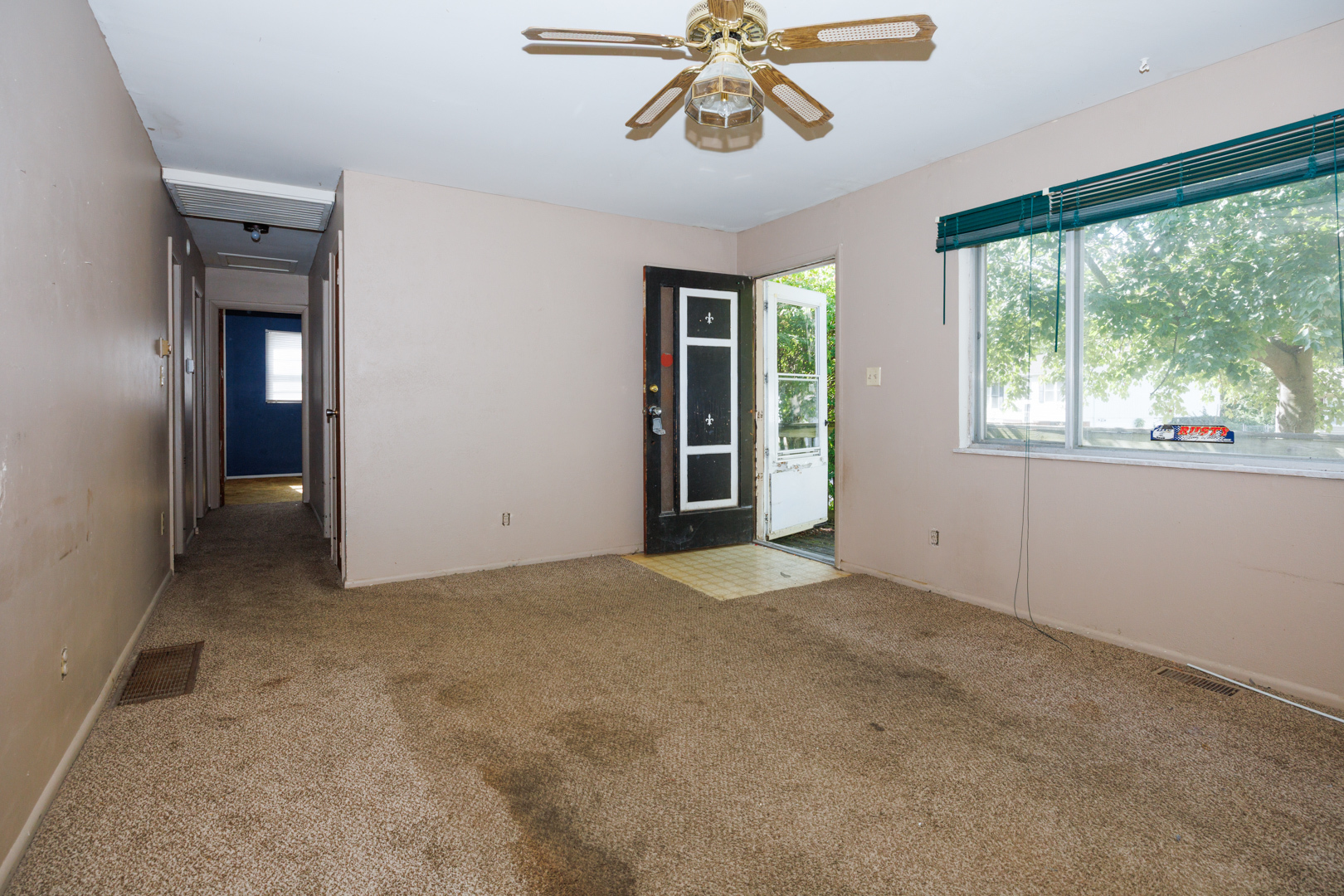1307 Glenwood Road Bloomington, IL 61704 - Photo 5 of 21 a view of an empty room with a window