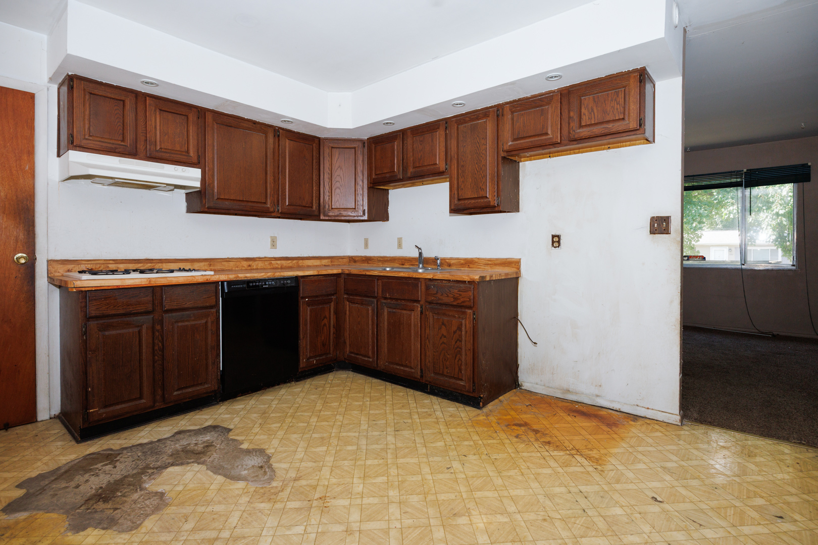 1307 Glenwood Road Bloomington, IL 61704 - Photo 7 of 21 a kitchen with a sink and cabinets
