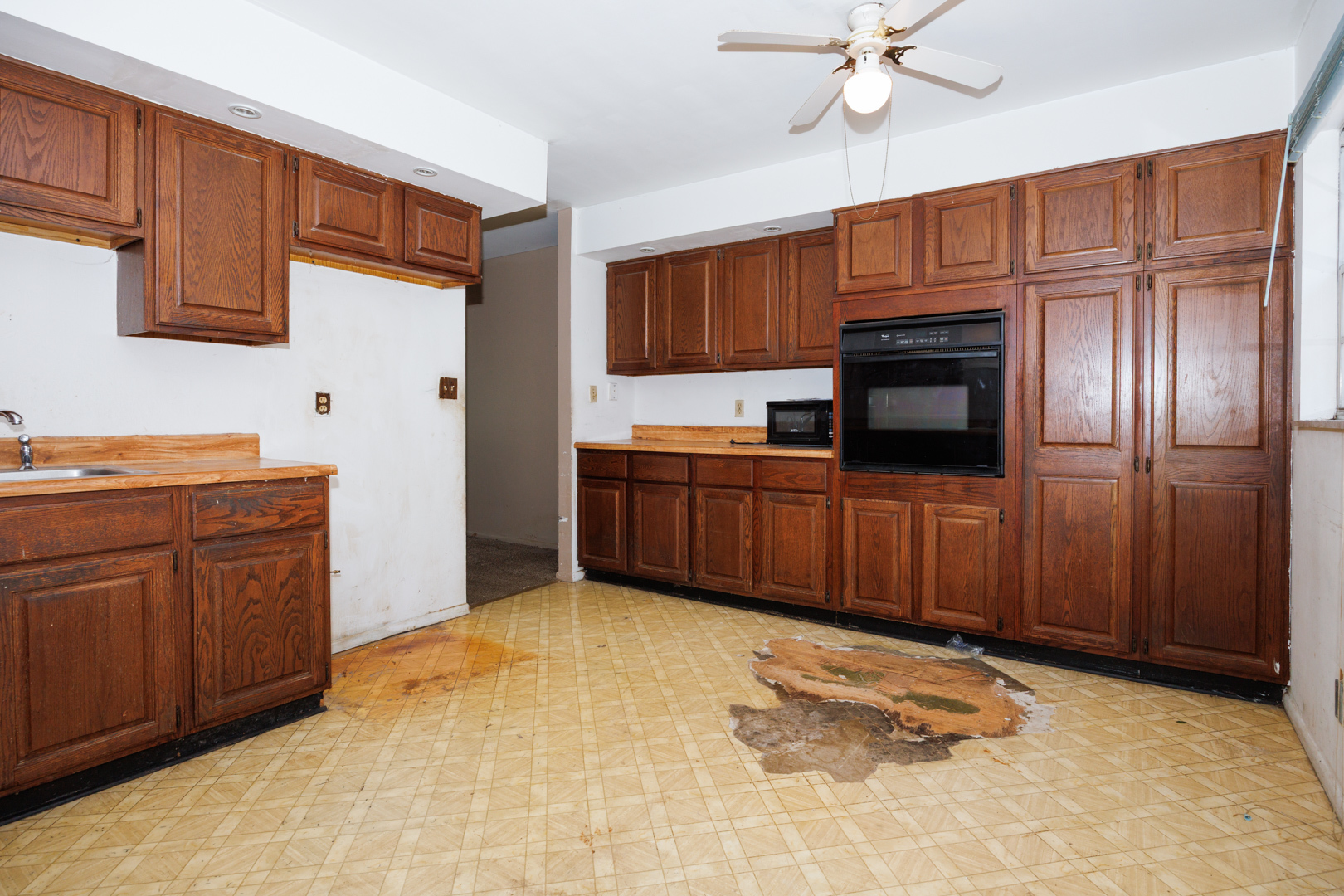 1307 Glenwood Road Bloomington, IL 61704 - Photo 8 of 21 a view of kitchen with stainless steel appliances granite countertop wooden cabinets a refrigerator and a sink