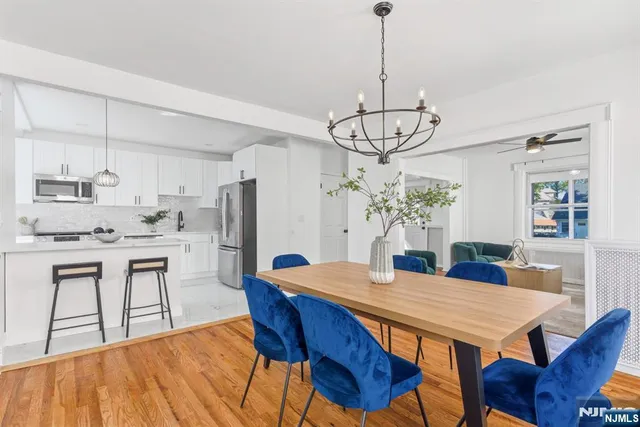 a view of a small space with wooden floor and a window