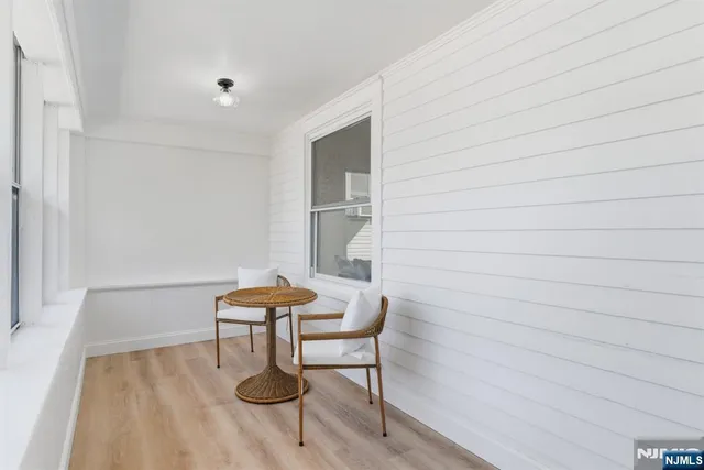a view of a dining room with furniture wooden floor and chandelier