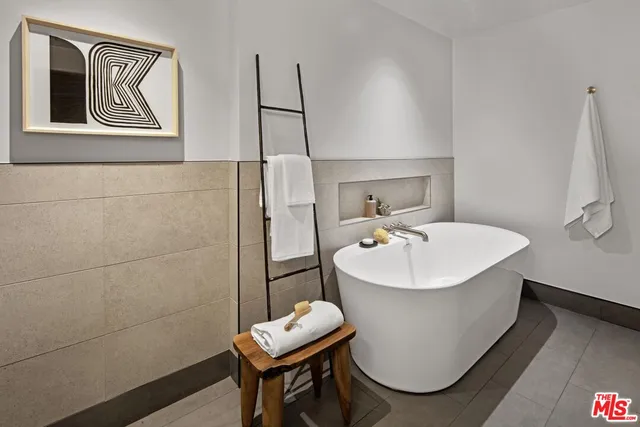 a bathroom with a sink toilet and mirror