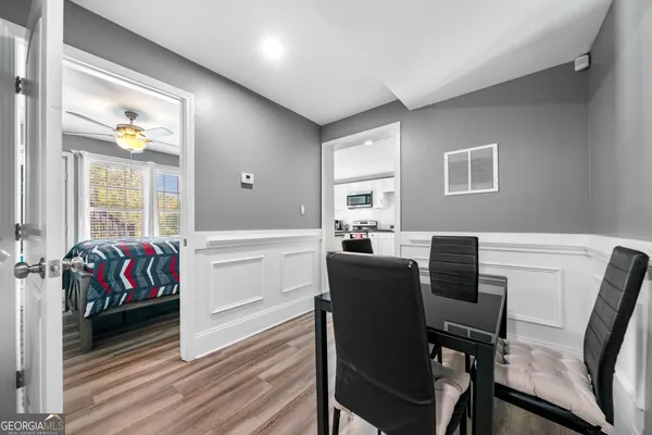 a livingroom with furniture and a dining table