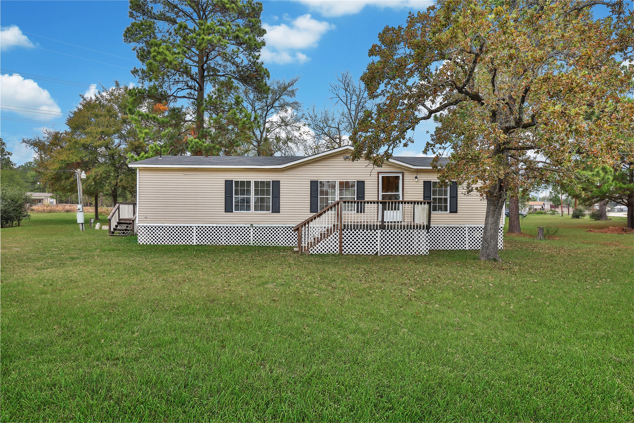 2 Jacob Street Huntsville, TX 77320 - Photo 1 of 20 a front view of a house with a garden