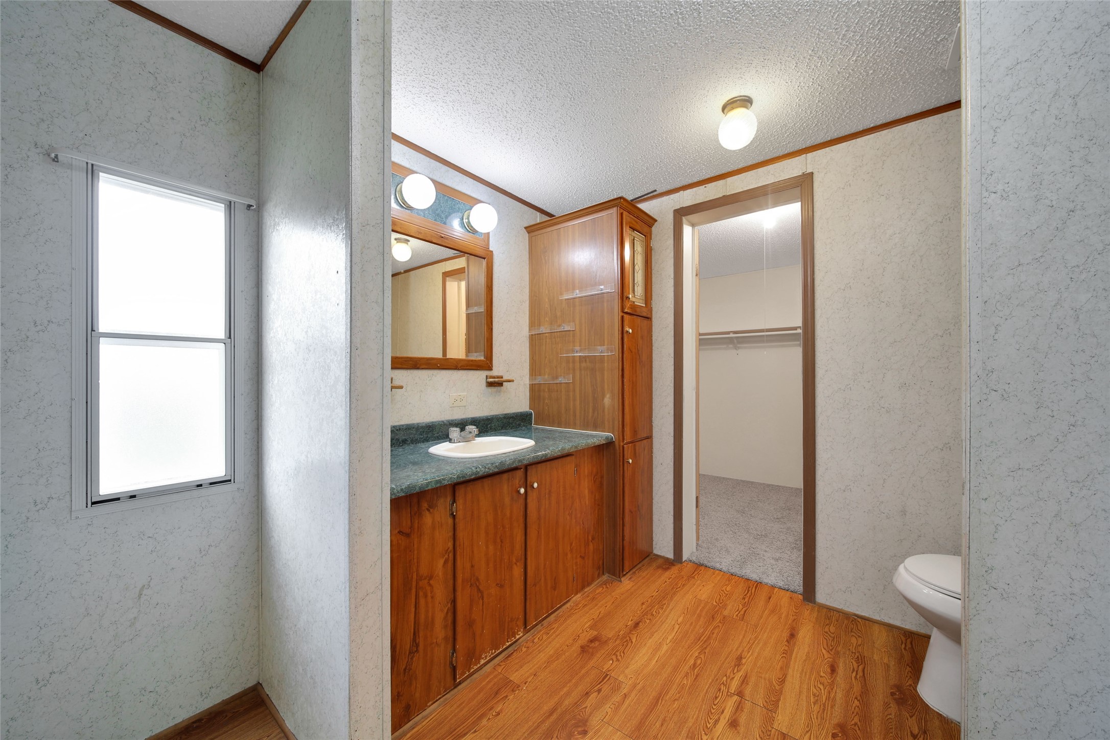 2 Jacob Street Huntsville, TX 77320 - Photo 16 of 20 a bathroom with a sink a toilet and shower