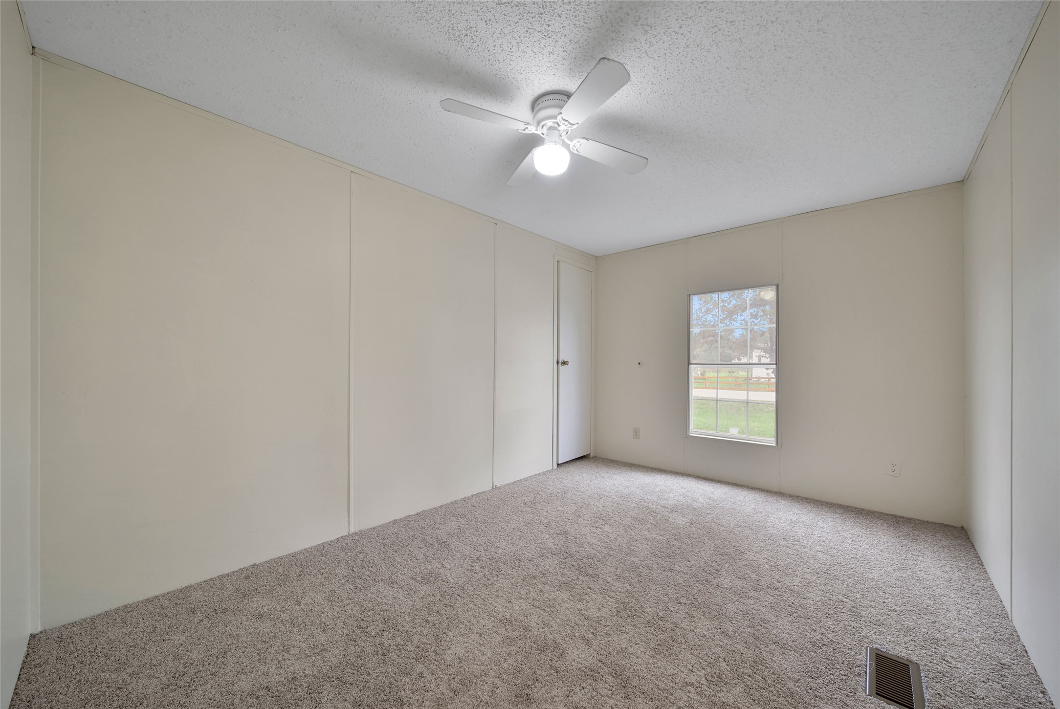 2 Jacob Street Huntsville, TX 77320 - Photo 18 of 20 a view of an empty room with a window