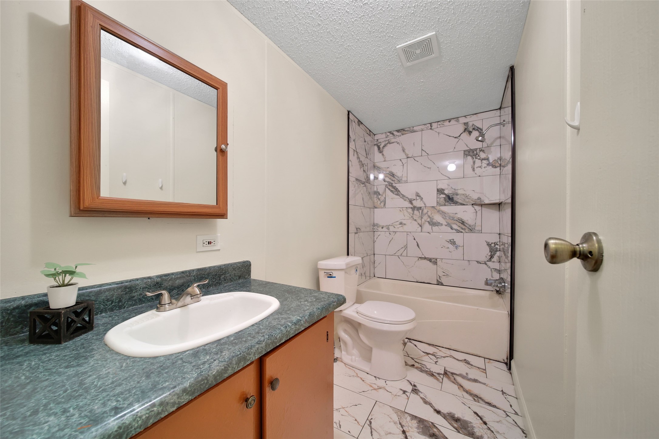 2 Jacob Street Huntsville, TX 77320 - Photo 19 of 20 a bathroom with a granite countertop sink toilet and shower