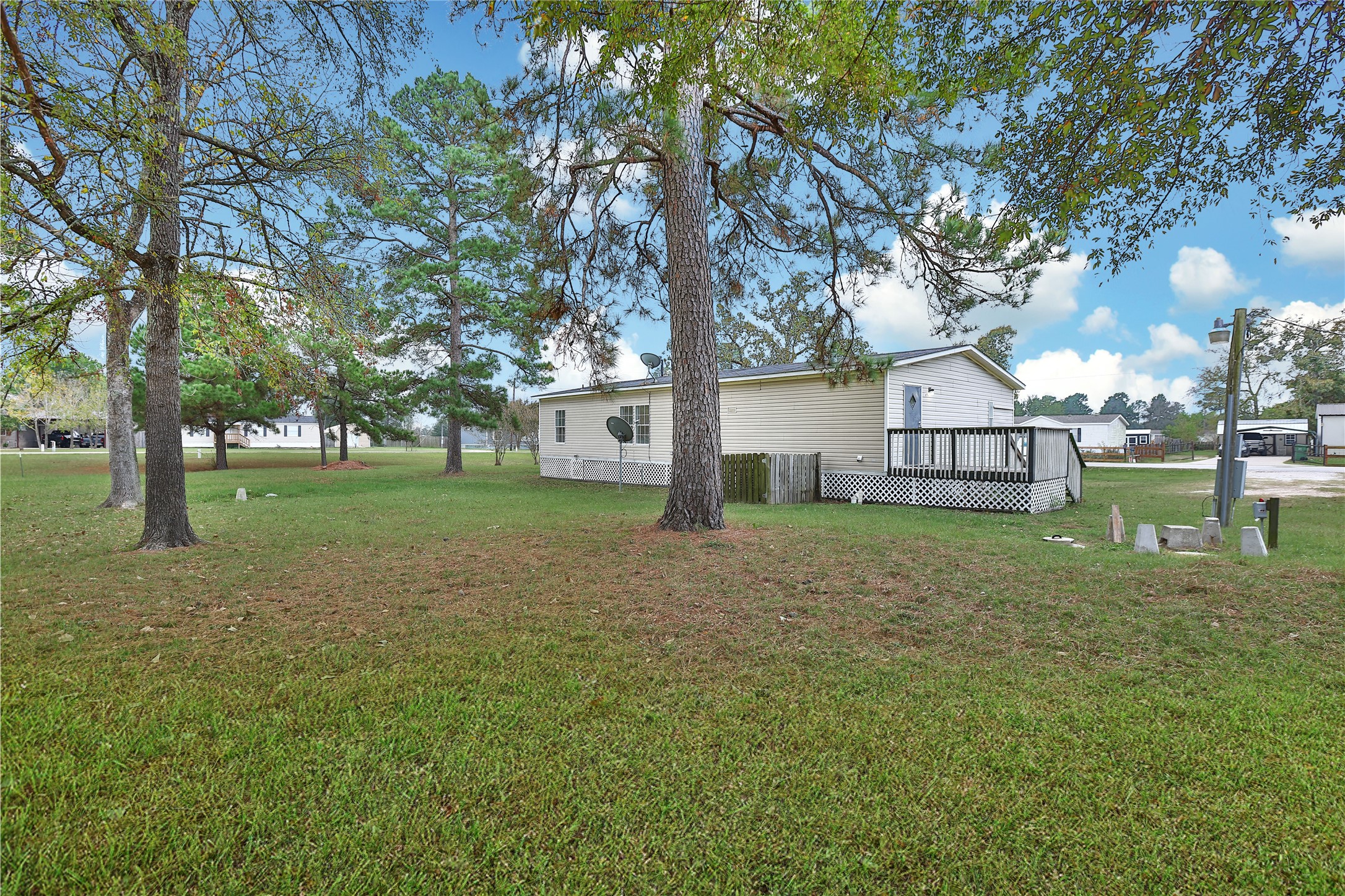 2 Jacob Street Huntsville, TX 77320 - Photo 3 of 20 a view of a house with backyard and trees