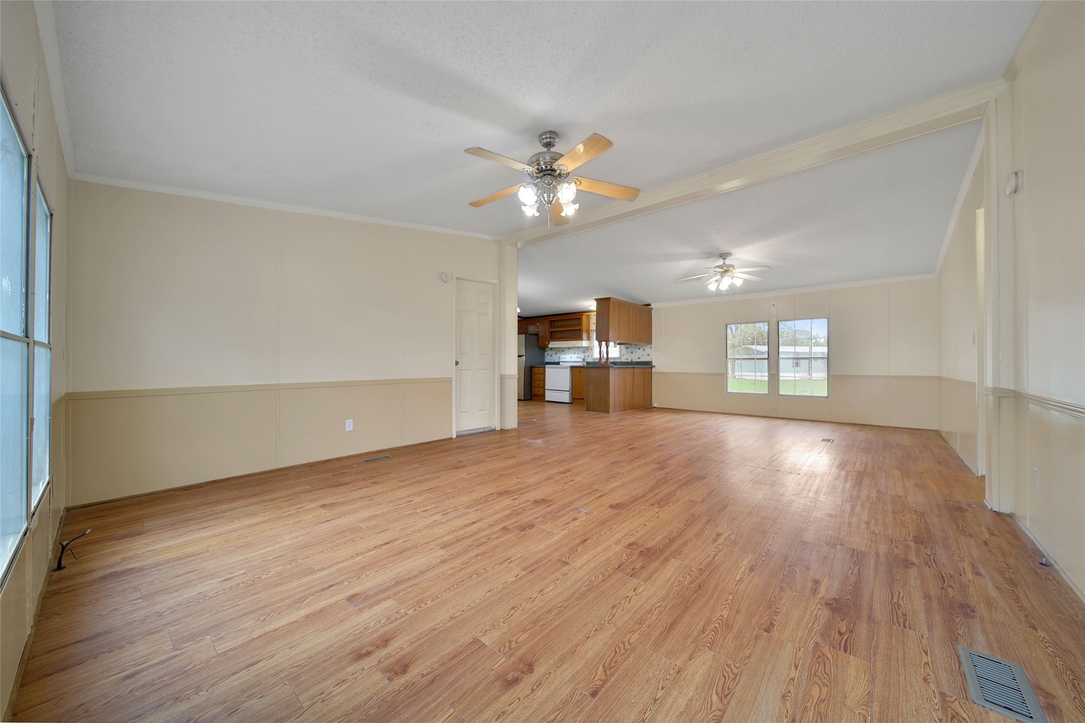 2 Jacob Street Huntsville, TX 77320 - Photo 5 of 20 wooden floor in an empty room with a window