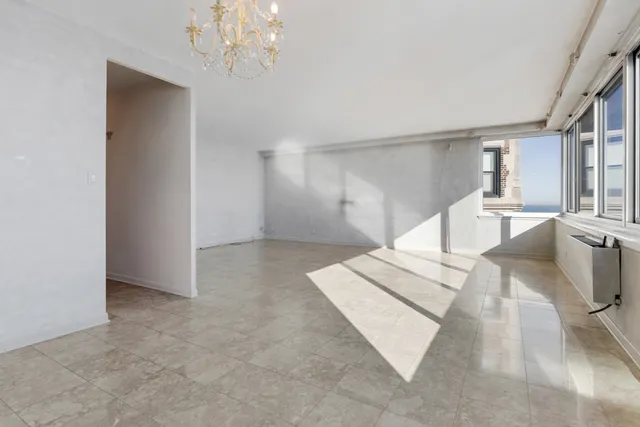 a view of a hallway with a chandelier