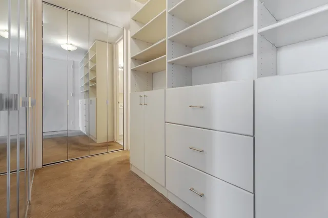 a bathroom with a granite countertop sink a toilet and bathtub