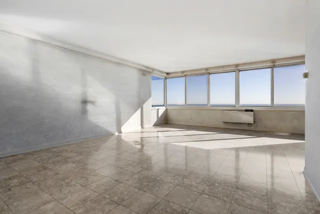 a view of water heater room with a wooden floor