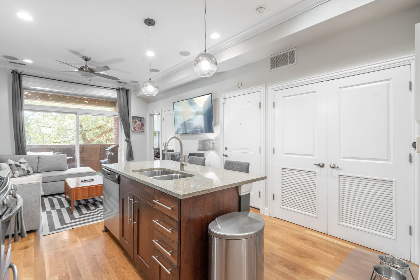 2624 West Rice Street, Unit 2F Chicago, IL 60622 - Photo 4 of 17 a kitchen with a sink stove and wooden floor