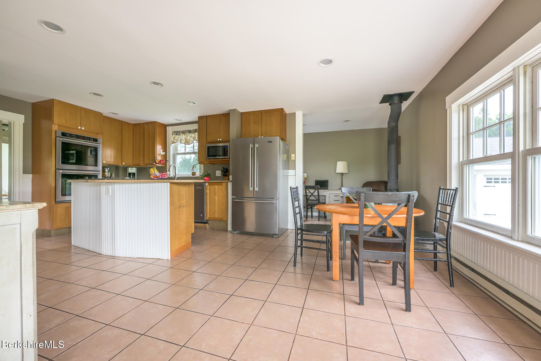 955 Barker Road Pittsfield, MA 01201 - Photo 11 of 35 a kitchen with stainless steel appliances a refrigerator and a stove top oven