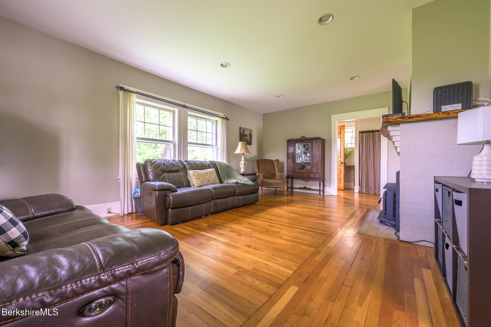 955 Barker Road Pittsfield, MA 01201 - Photo 15 of 35 a spacious bedroom with a bed and a couch