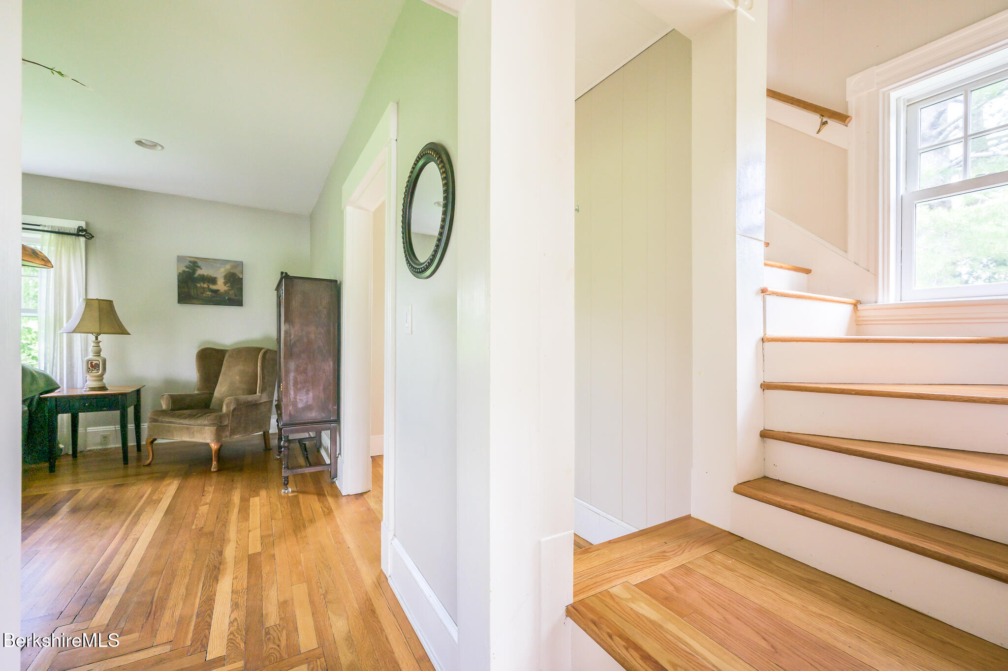 955 Barker Road Pittsfield, MA 01201 - Photo 16 of 35 a view of a bedroom with wooden floor and windows