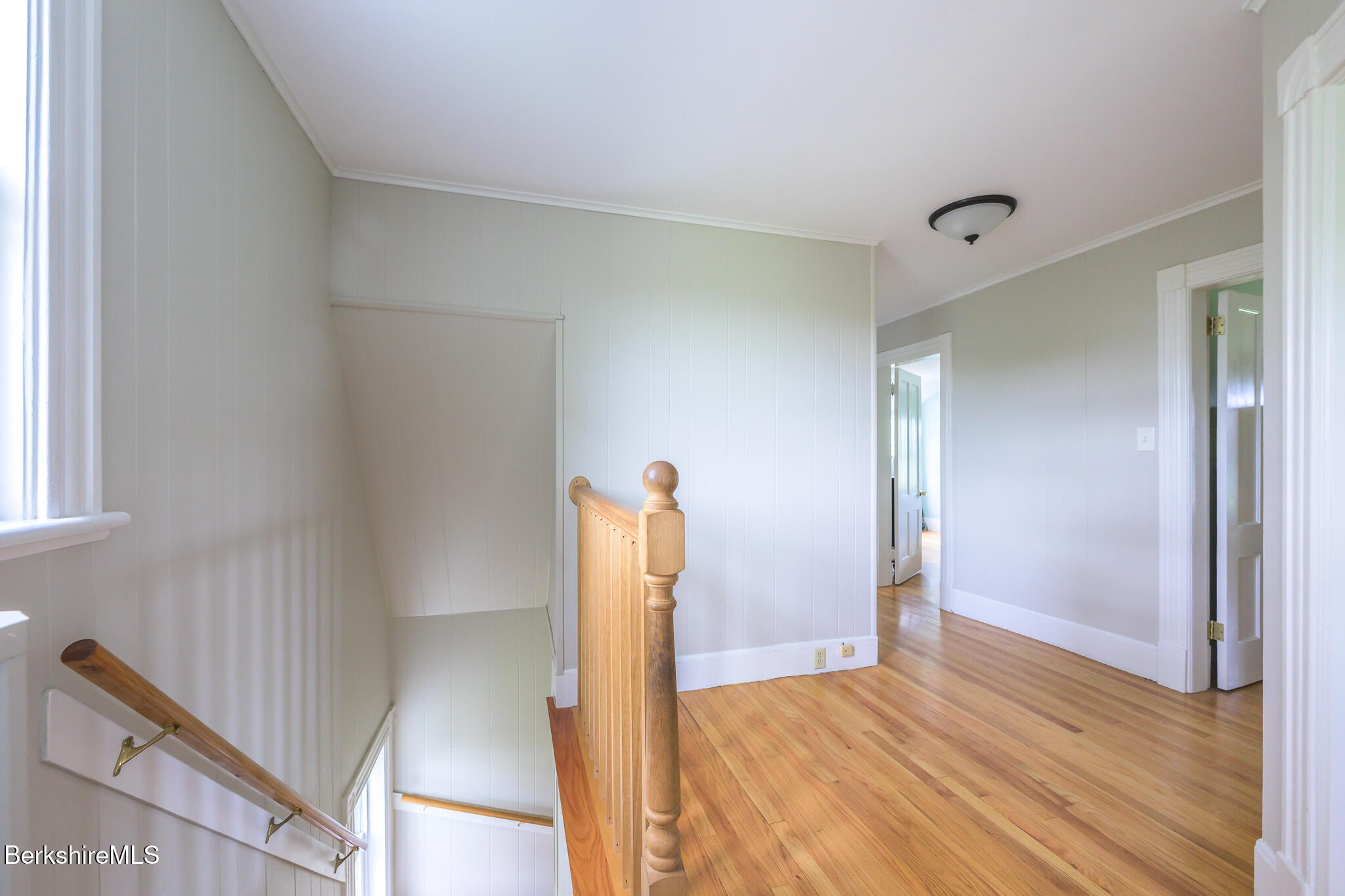 955 Barker Road Pittsfield, MA 01201 - Photo 17 of 35 a view of a livingroom with wooden floor and stairs