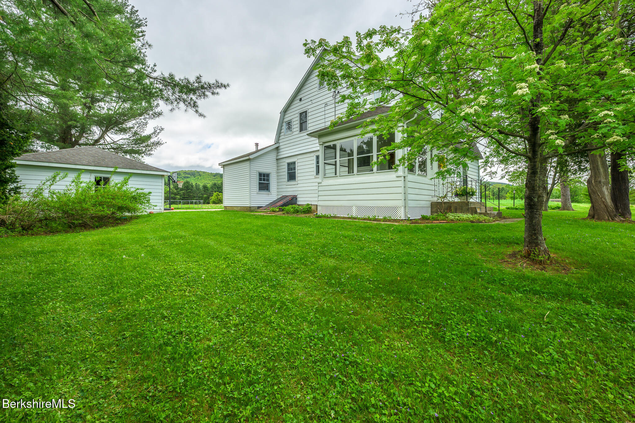 955 Barker Road Pittsfield, MA 01201 - Photo 30 of 35 a front view of a house with a yard
