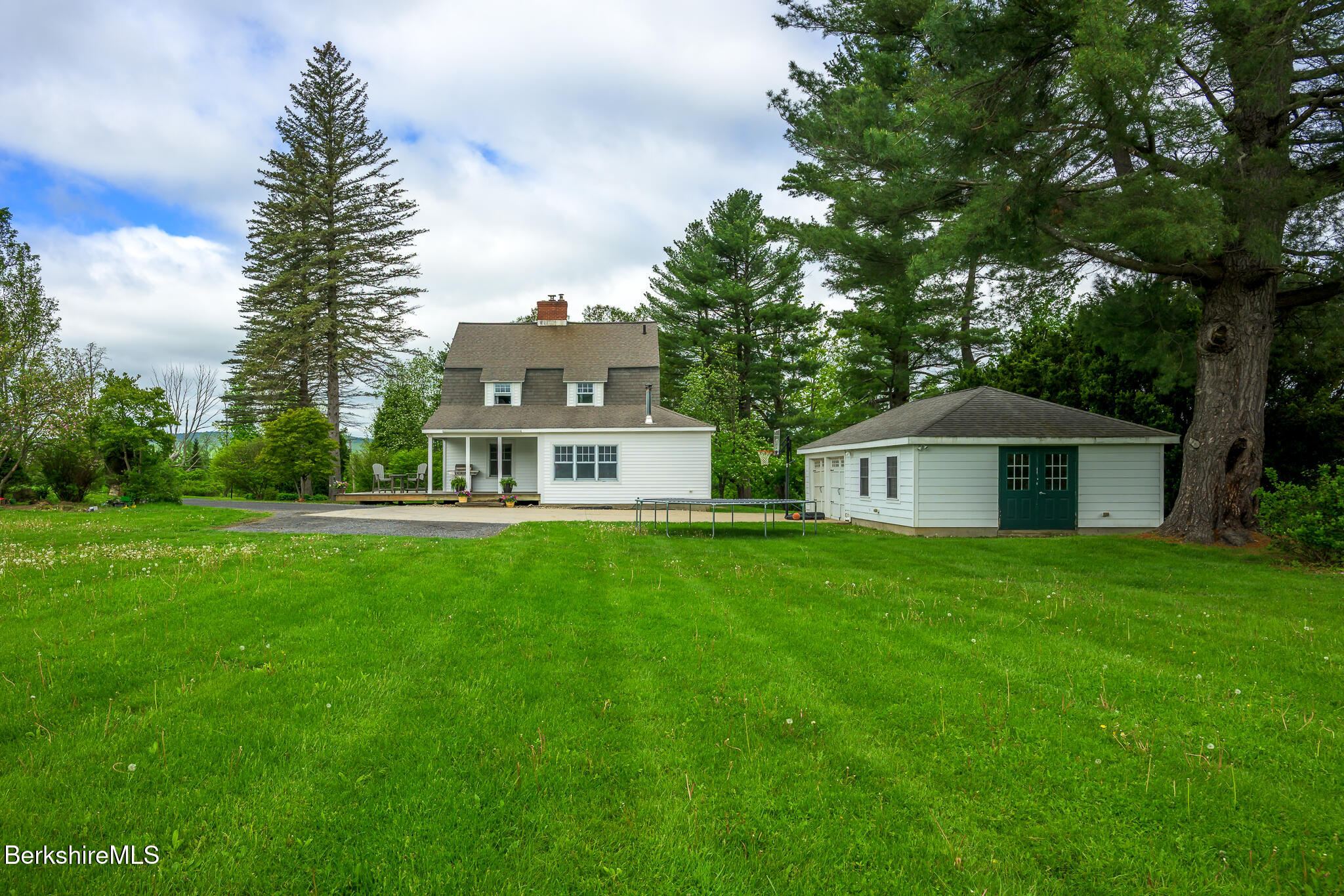 955 Barker Road Pittsfield, MA 01201 - Photo 31 of 35 a front view of a house with a garden