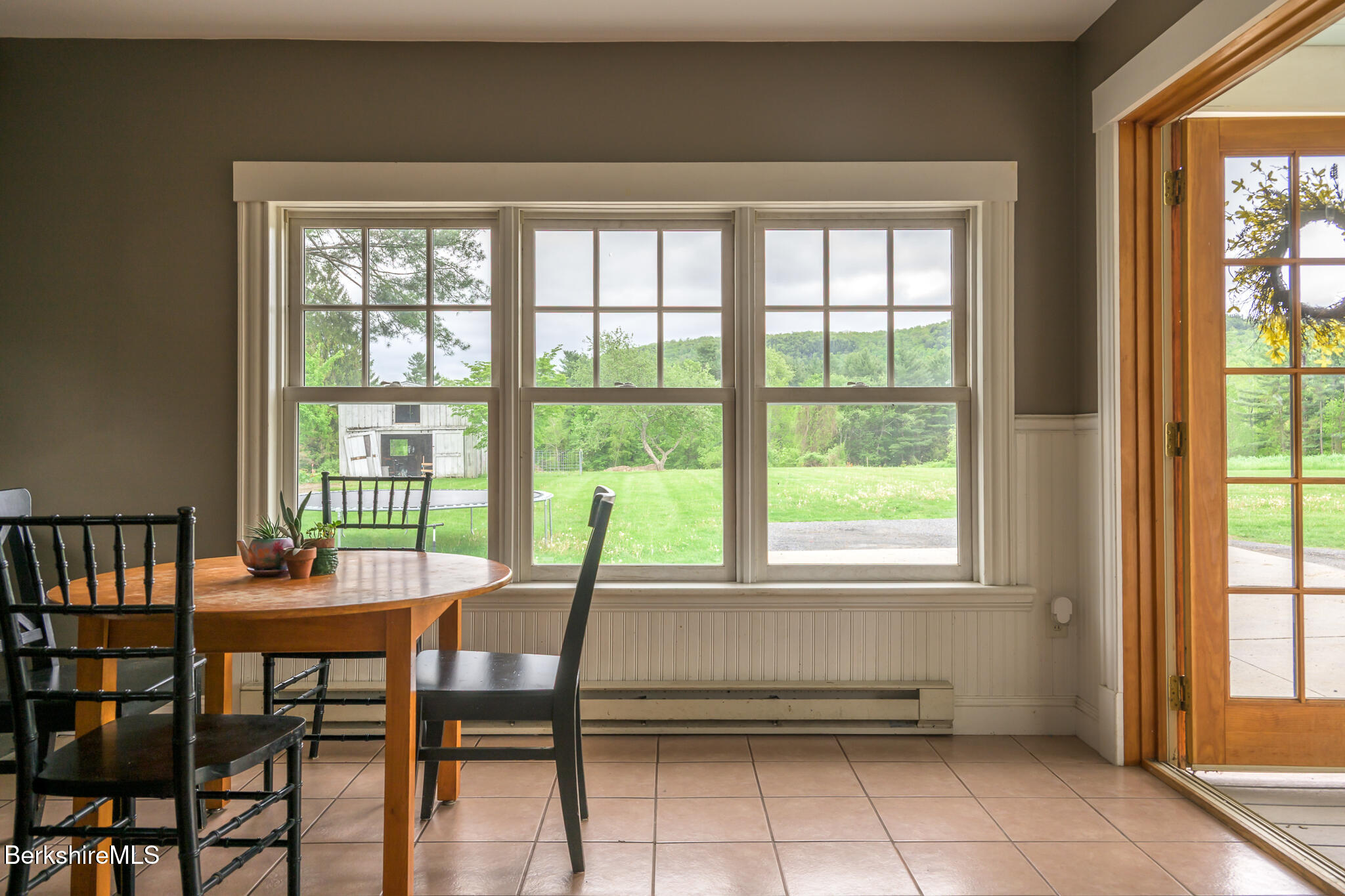 955 Barker Road Pittsfield, MA 01201 - Photo 7 of 35 a view of a dining room with furniture and a window
