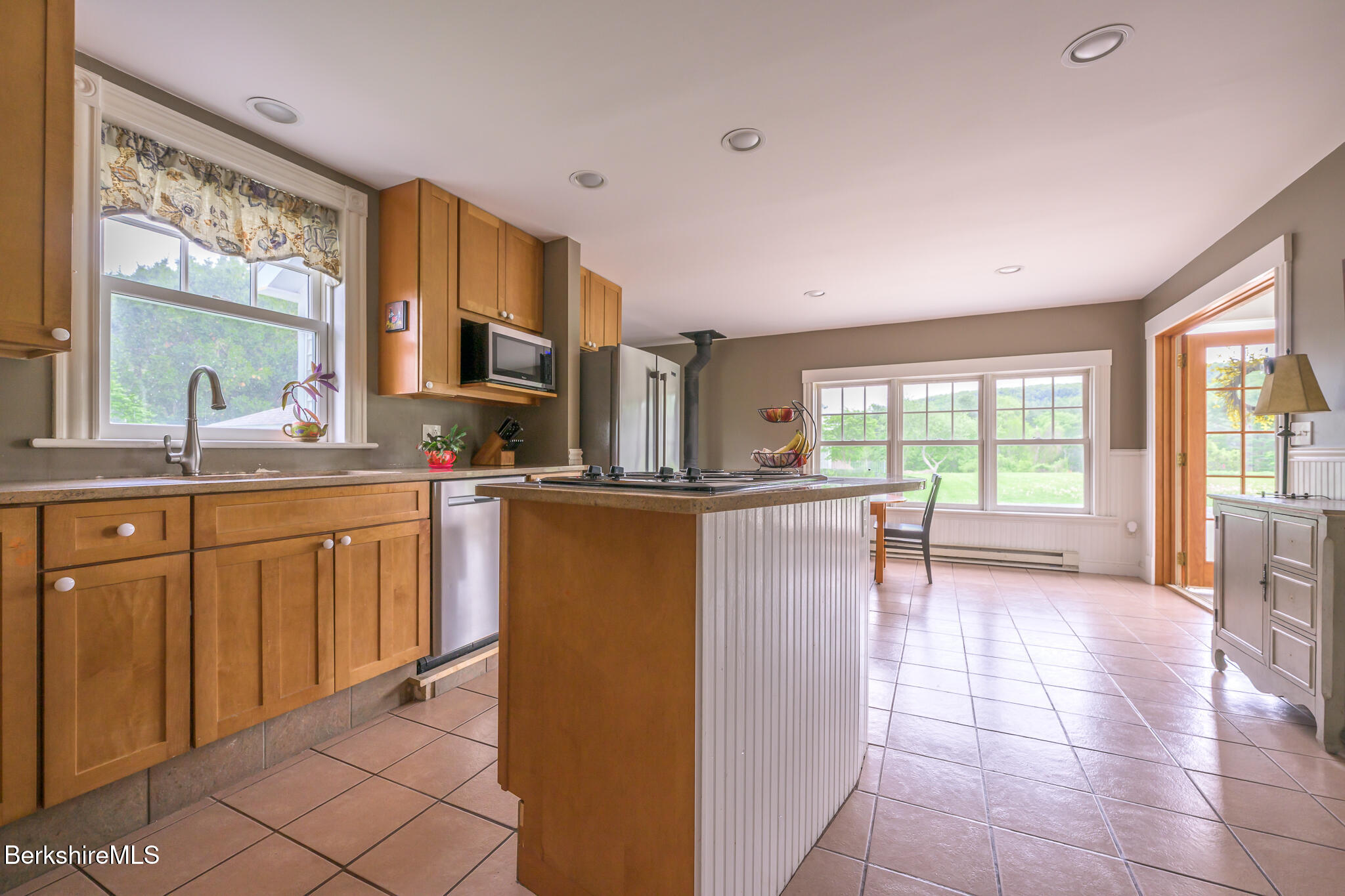 955 Barker Road Pittsfield, MA 01201 - Photo 8 of 35 a kitchen with stainless steel appliances granite countertop a refrigerator a sink dishwasher a oven with white cabinets and wooden floor