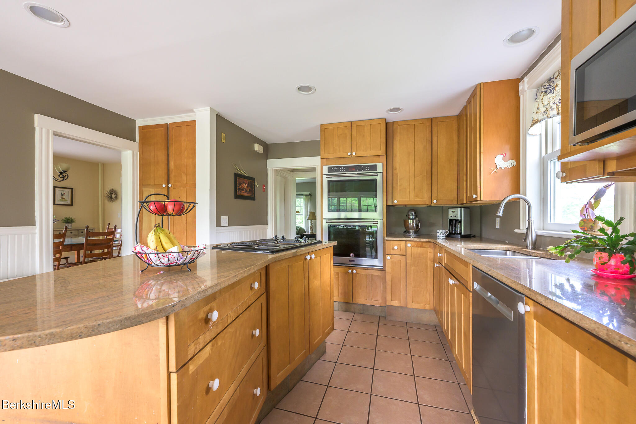 955 Barker Road Pittsfield, MA 01201 - Photo 9 of 35 a large kitchen with stainless steel appliances granite countertop a sink and cabinets
