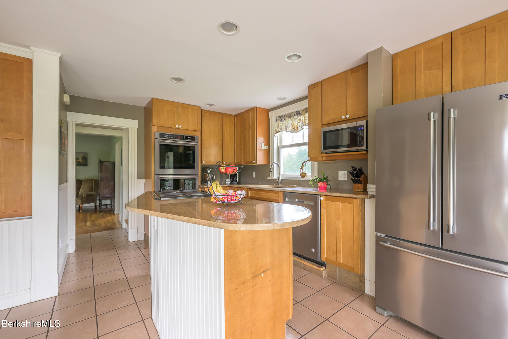 955 Barker Road Pittsfield, MA 01201 - Photo 10 of 35 a kitchen with stainless steel appliances granite countertop a refrigerator and a sink