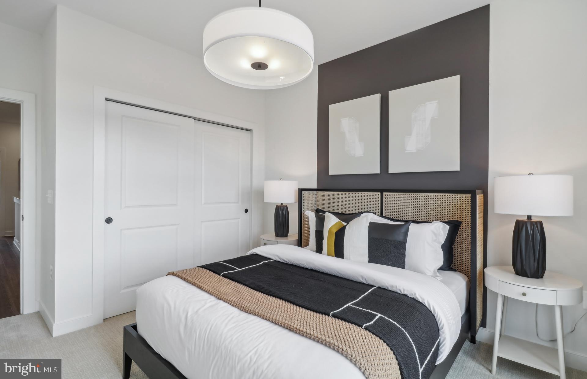 16146 Frederick Road Rockville, MD 20850 - Photo 18 of 41 a bedroom with a bed and lamp