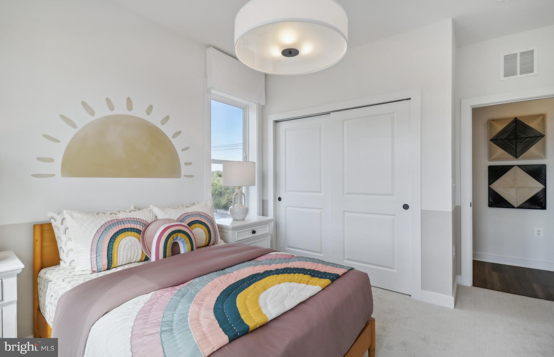 16146 Frederick Road Rockville, MD 20850 - Photo 21 of 41 a bedroom with a bed and a painting on the wall