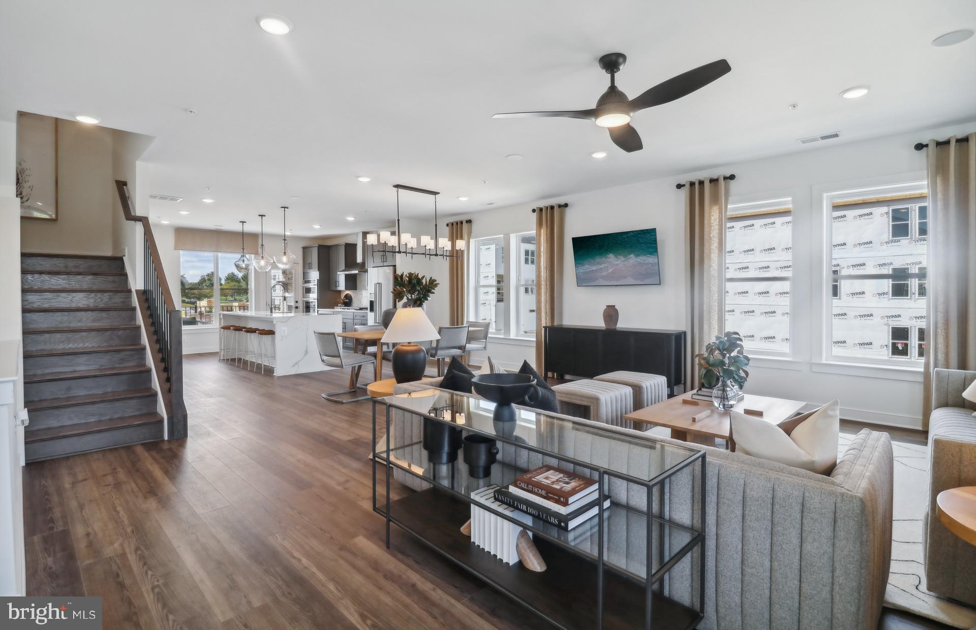 16146 Frederick Road Rockville, MD 20850 - Photo 41 of 41 a living room with furniture a fireplace and a flat screen tv