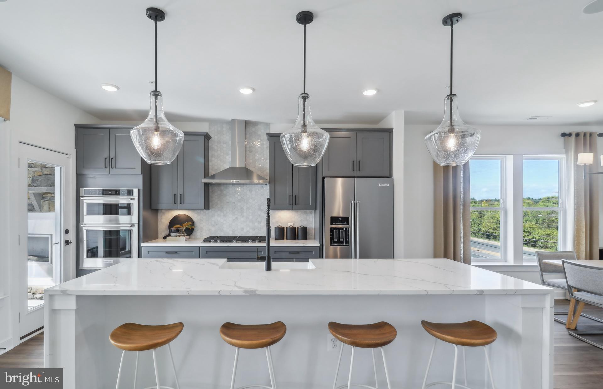 16146 Frederick Road Rockville, MD 20850 - Photo 6 of 41 a large kitchen with a table and chairs in it