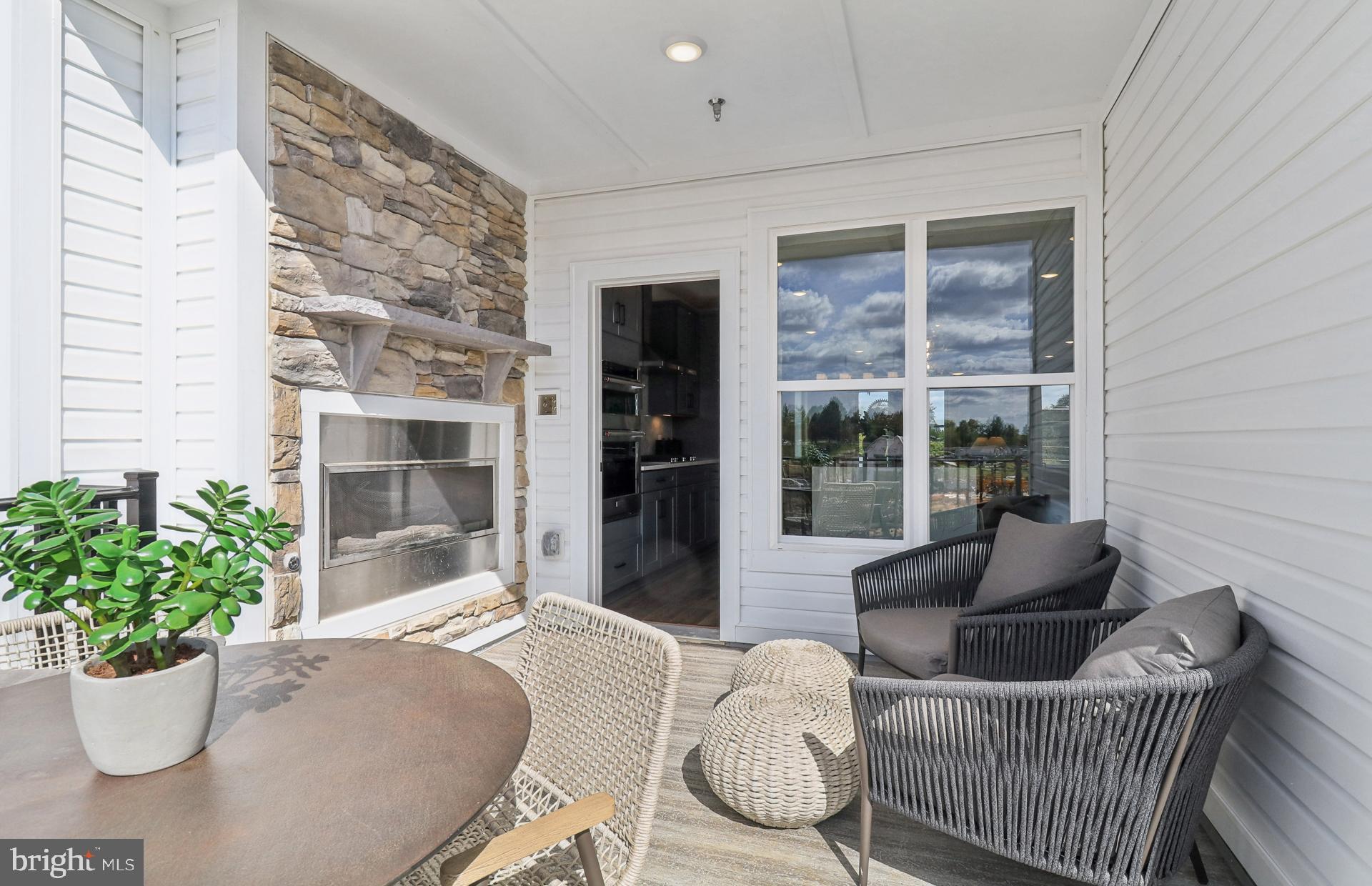 16146 Frederick Road Rockville, MD 20850 - Photo 9 of 41 a living room with furniture potted plant and a window