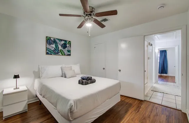 a bedroom with a bed and a dresser