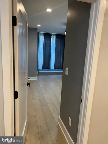 a view of entryway with wooden floor