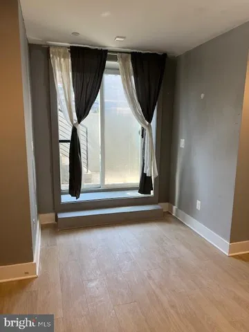 a bathroom with a glass shower door