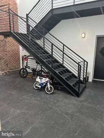 an open kitchen with a stove and a fan