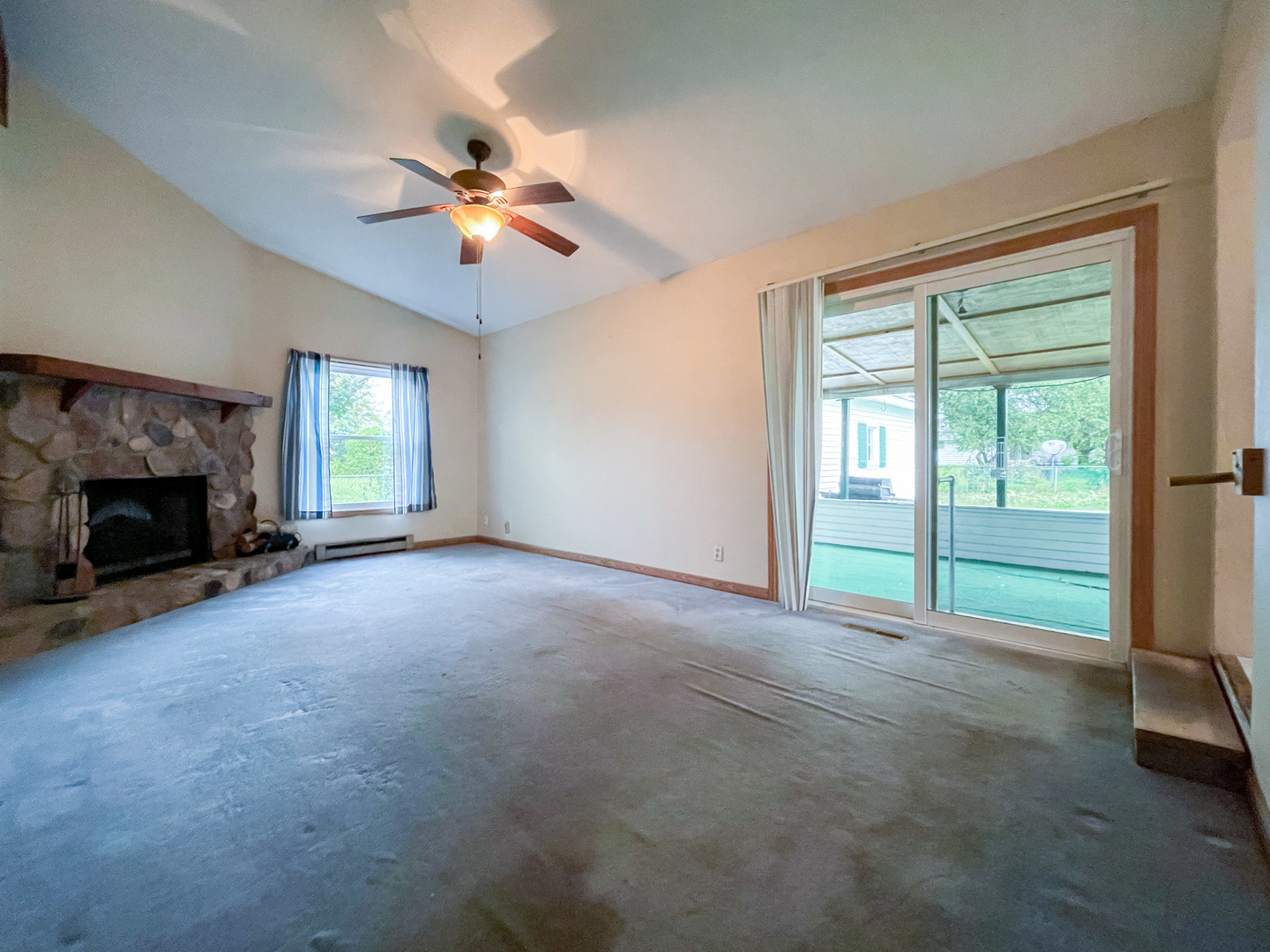 8010 Kasson Road Harvard, IL 60033 - Photo 12 of 40 a view of an empty room with window and fireplace