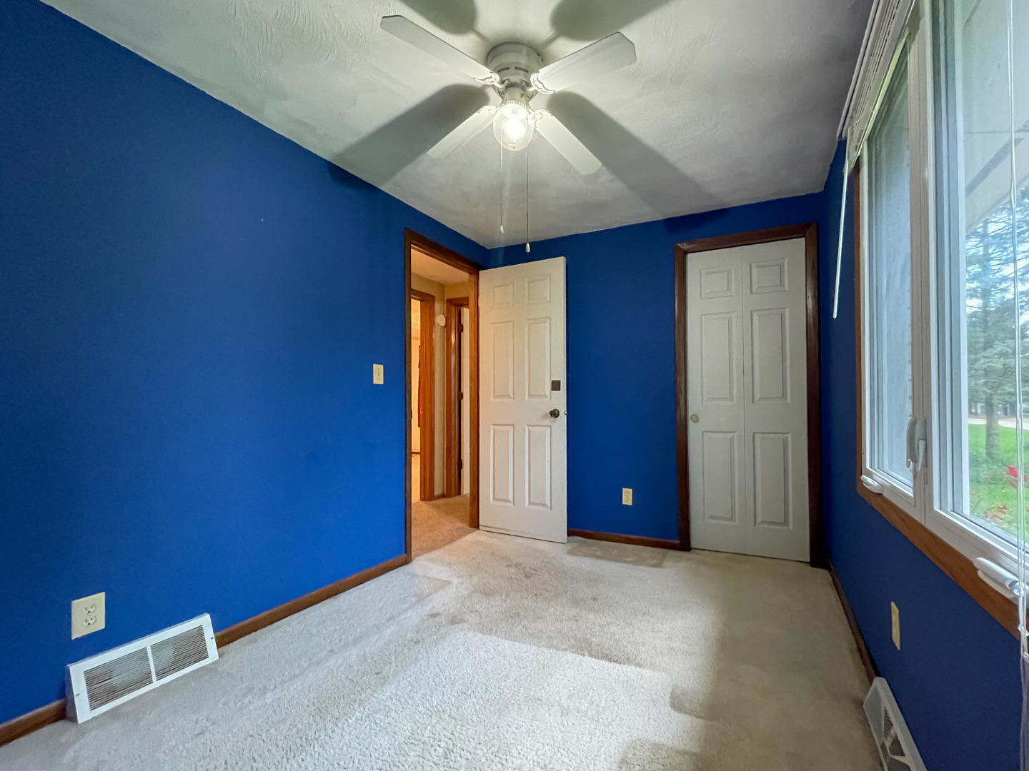 8010 Kasson Road Harvard, IL 60033 - Photo 14 of 40 a view of a livingroom with a chandelier fan and windows