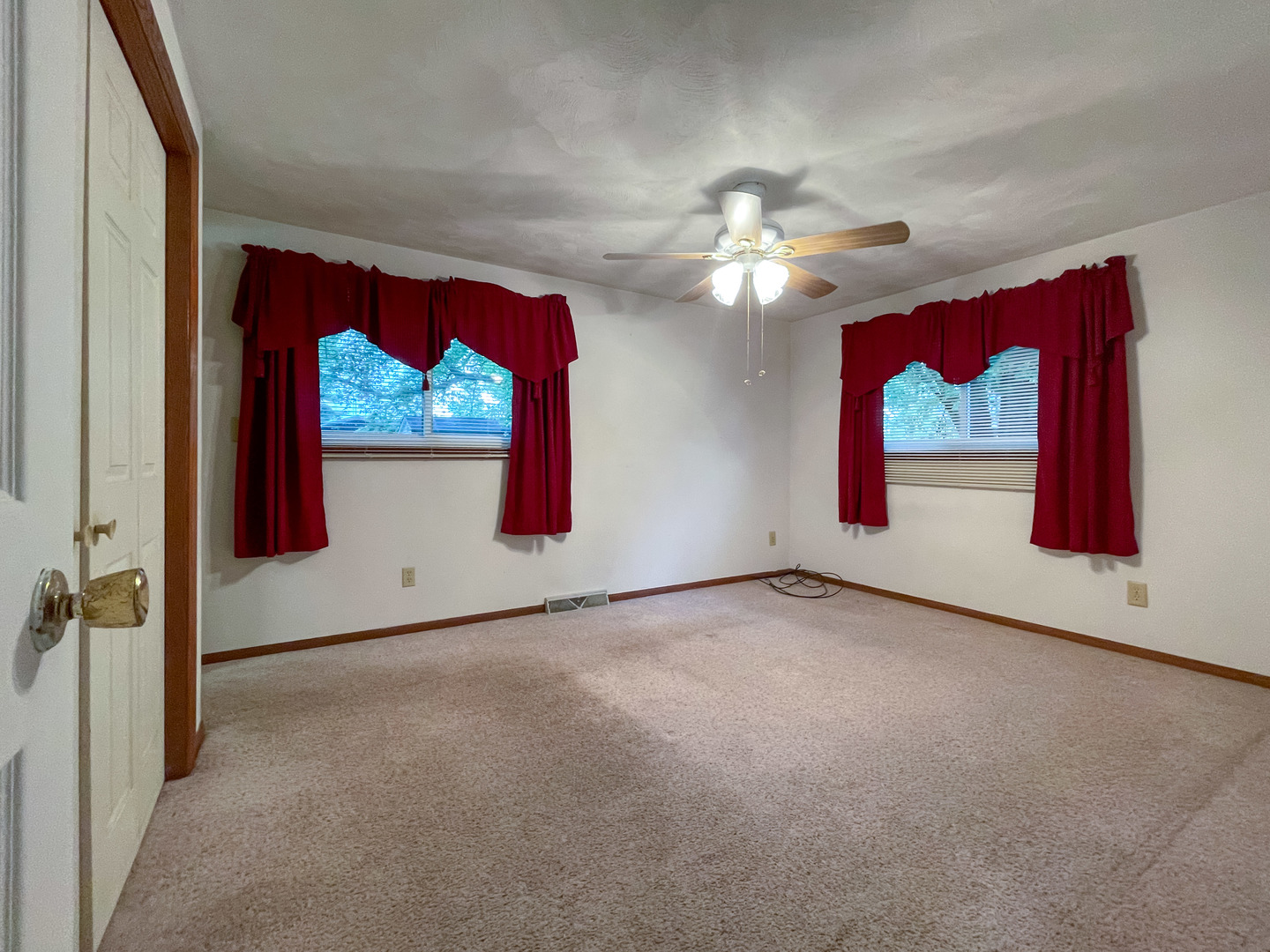 8010 Kasson Road Harvard, IL 60033 - Photo 17 of 40 an empty room with windows and fan