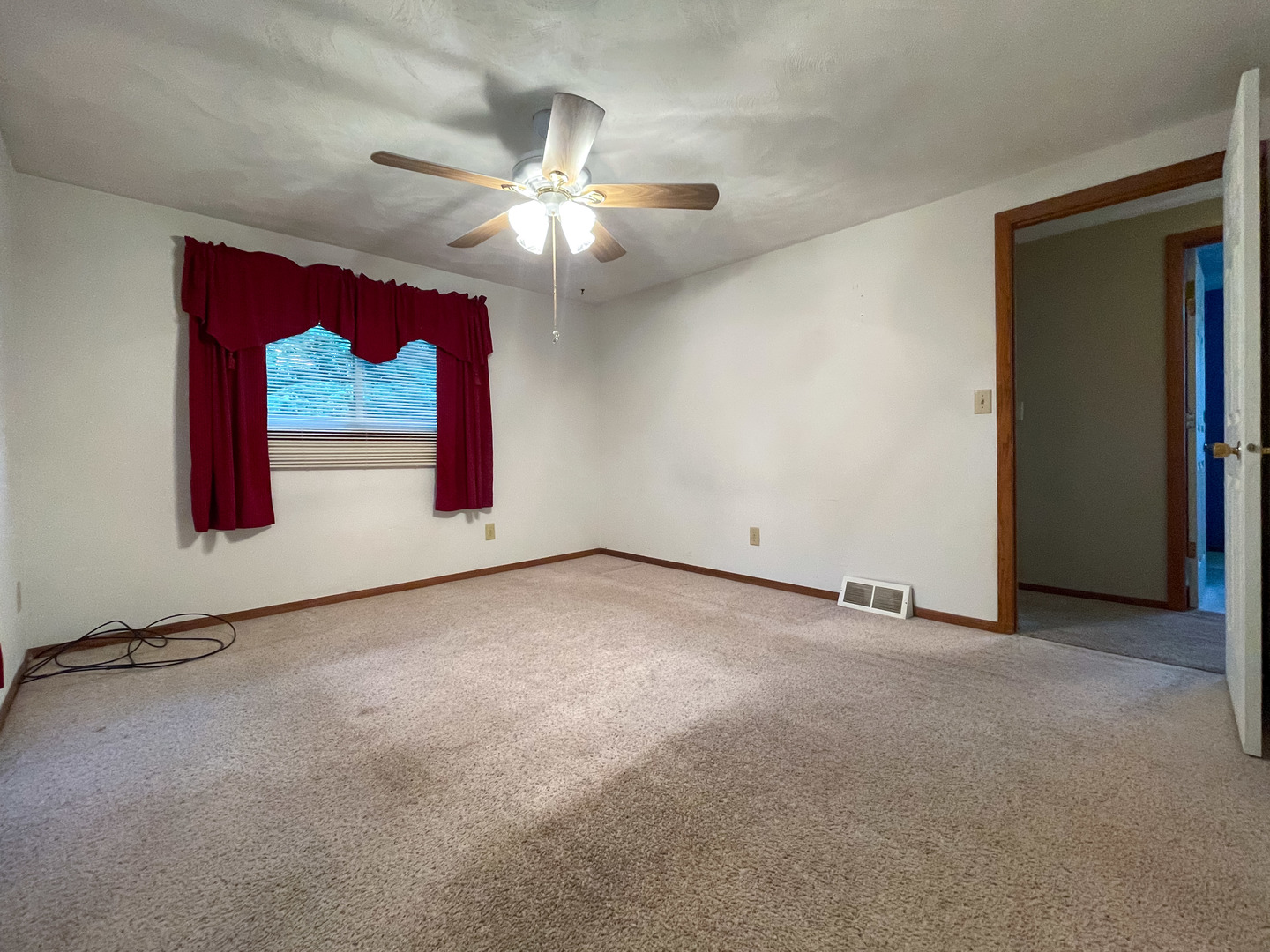 8010 Kasson Road Harvard, IL 60033 - Photo 18 of 40 an empty room with windows and fan