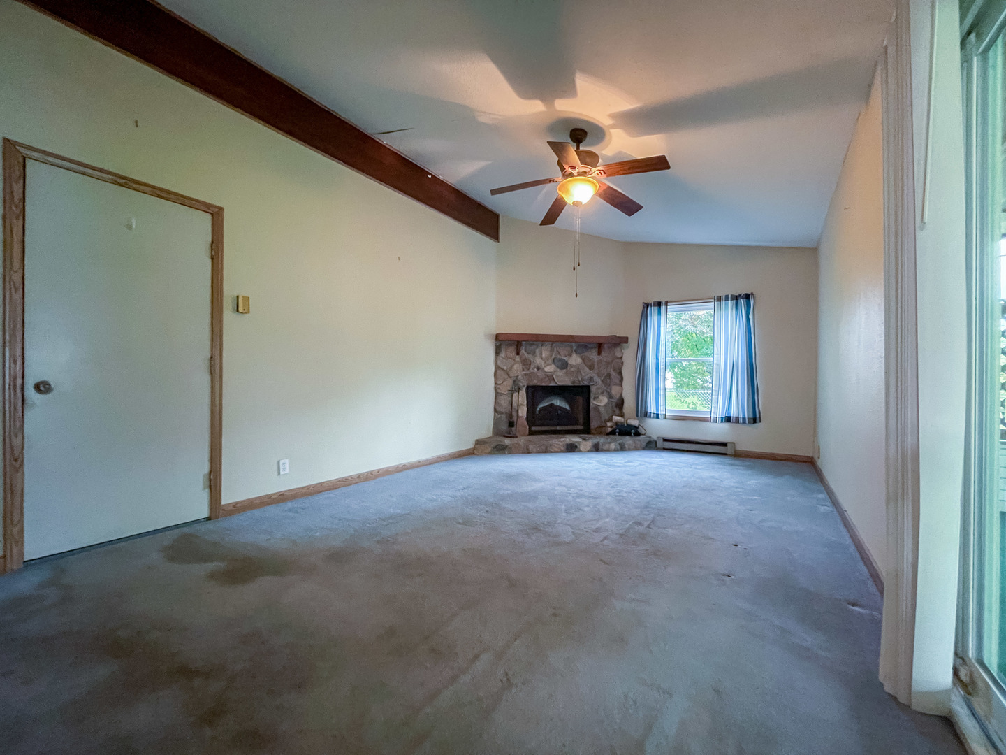 8010 Kasson Road Harvard, IL 60033 - Photo 24 of 40 a view of empty room with a fireplace and fan