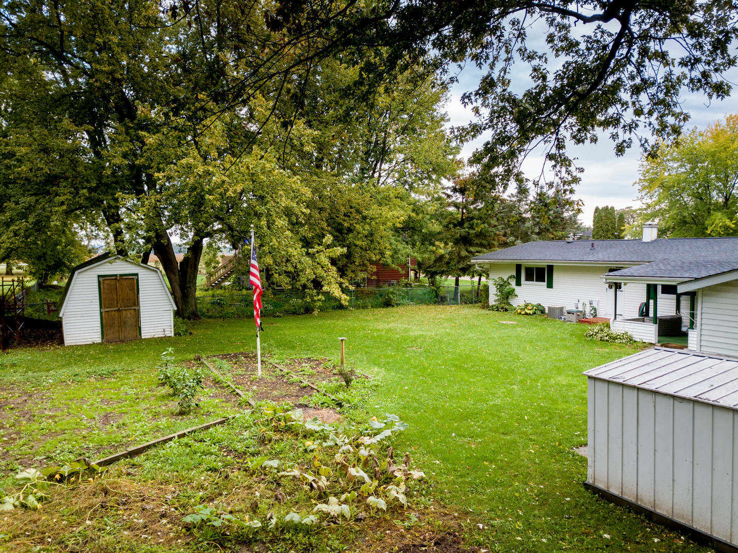 8010 Kasson Road Harvard, IL 60033 - Photo 29 of 40 a front view of a house with garden