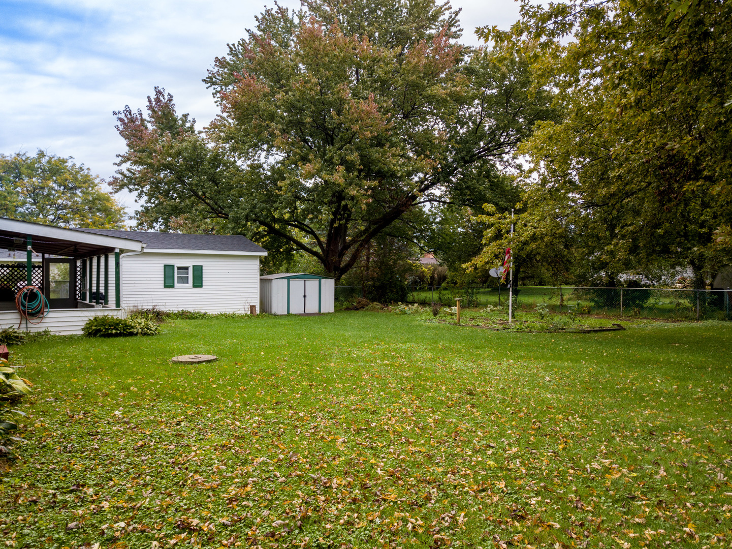 8010 Kasson Road Harvard, IL 60033 - Photo 30 of 40 a front view of a house with garden