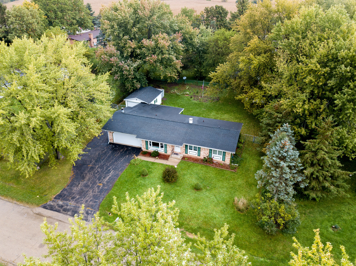 8010 Kasson Road Harvard, IL 60033 - Photo 32 of 40 a view of a back yard of the house and front of a house