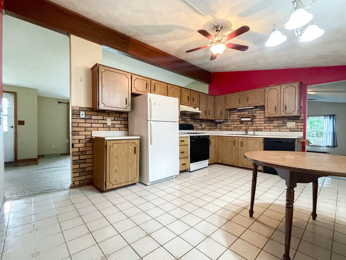 8010 Kasson Road Harvard, IL 60033 - Photo 8 of 40 a kitchen with cabinets and stainless steel appliances