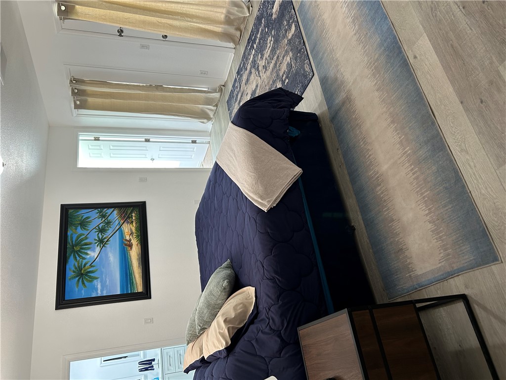 2191 Seneca Street Kingman, AZ 86401 - Photo 16 of 26 a bedroom with a bed and wooden floor