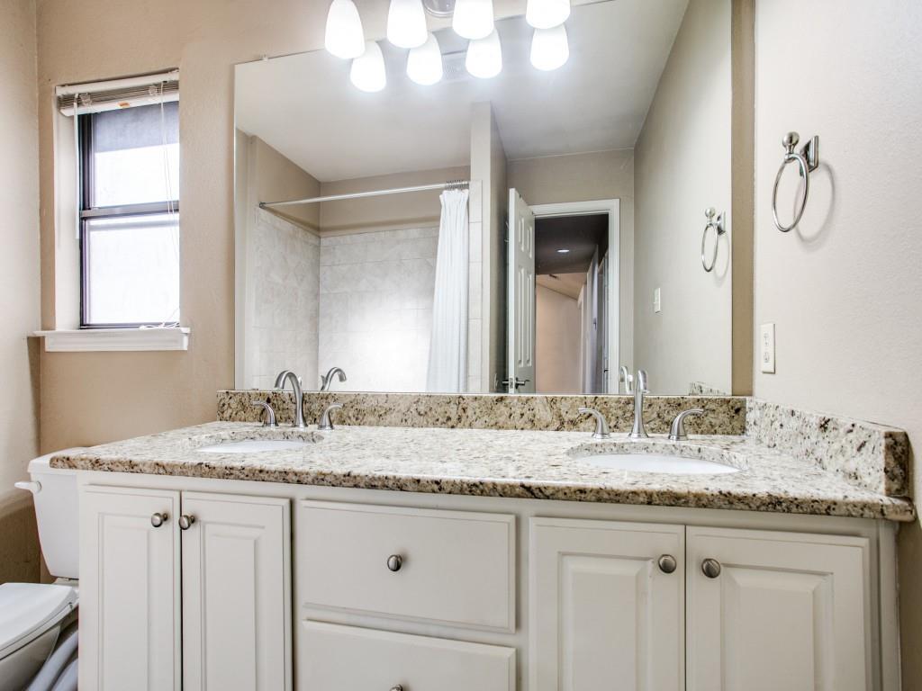 209 Ginger Lane Euless, TX 76039 - Photo 20 of 25 a bathroom with a granite countertop sink and a mirror