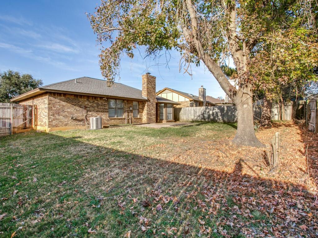 209 Ginger Lane Euless, TX 76039 - Photo 22 of 25 a front view of a house with a yard